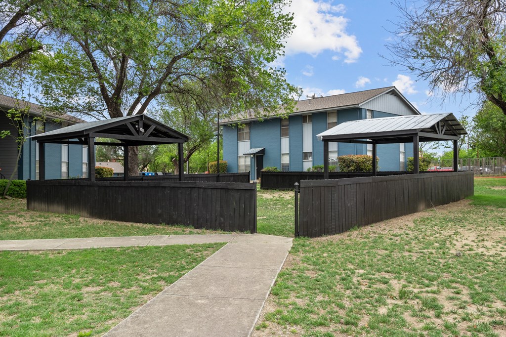 a house with a fence and two gazebos  at Sunset Heights, San Antonio, 78209