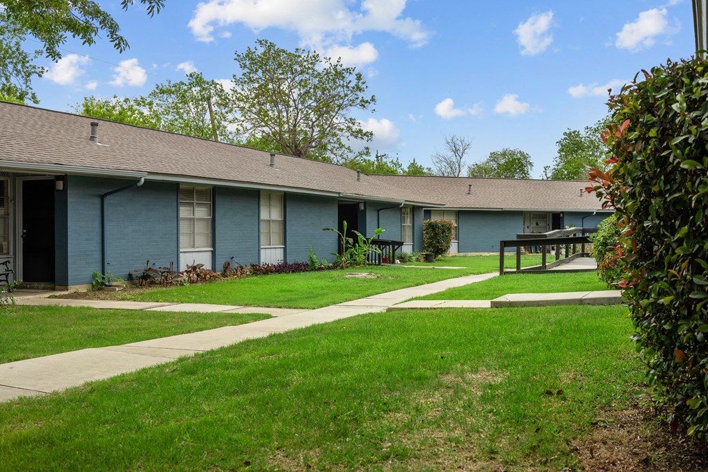 a blue building with a picnic table in front of it  at Sunset Heights, San Antonio, Texas