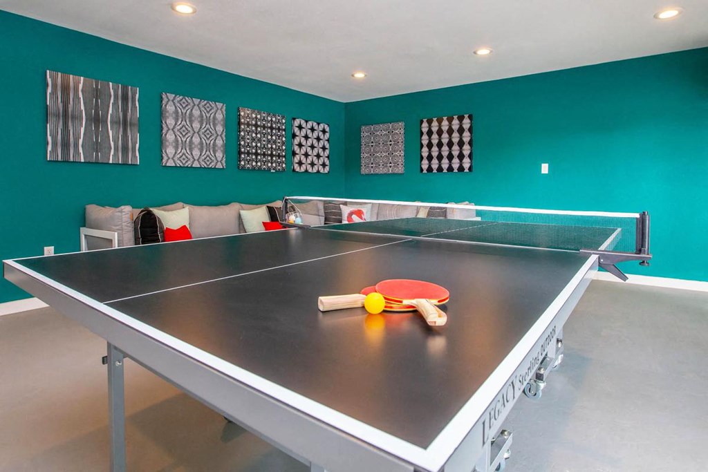 a ping pong table in the game room