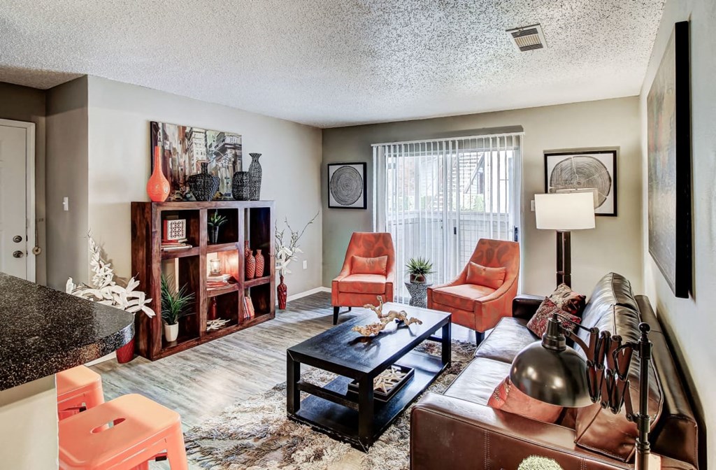 Living Room with lots of natural light and hardwood style floors at The Hills at Ironhorse, North Richland Hills, 76180