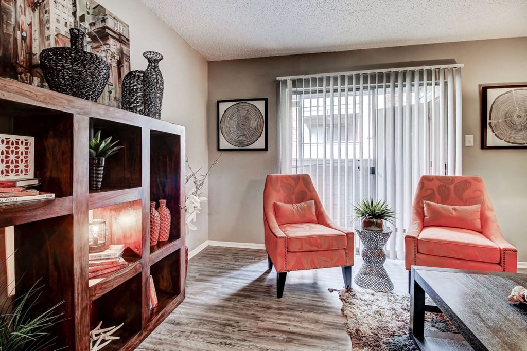 Large living room with lots of natural light and hardwood style floors at The Hills at Ironhorse, North Richland Hills, TX