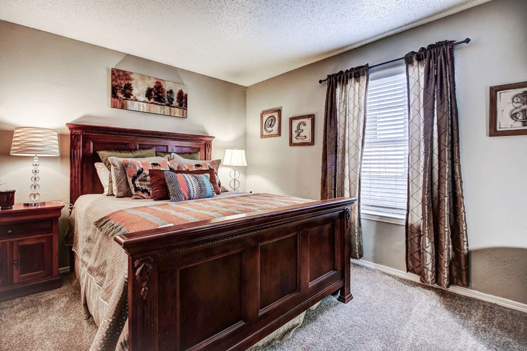 Master bedroom with carpet and lots of natural light at The Hills at Ironhorse, North Richland Hills, TX, 76180