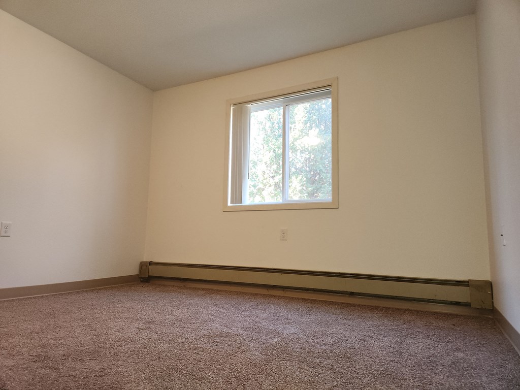 an empty room with a window in it