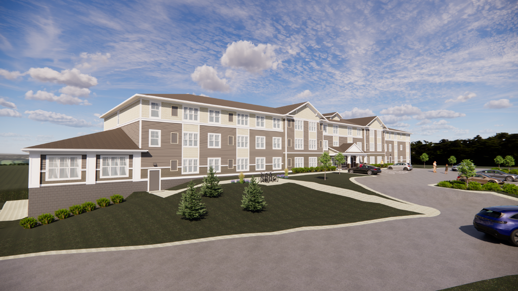 A large, modern building with a parking lot in front.