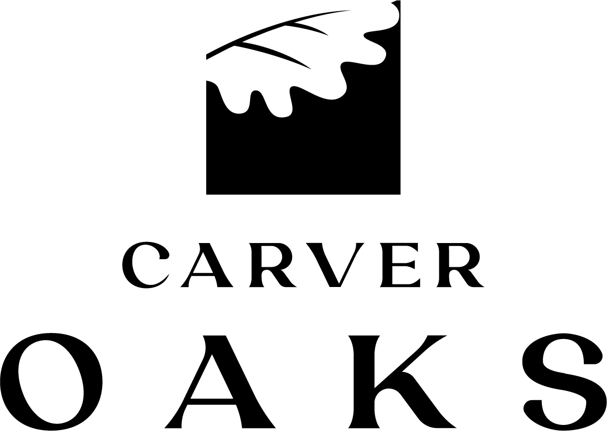 A logo with a black oak leaf on a white background and the words "CARVER OAKS" in black.