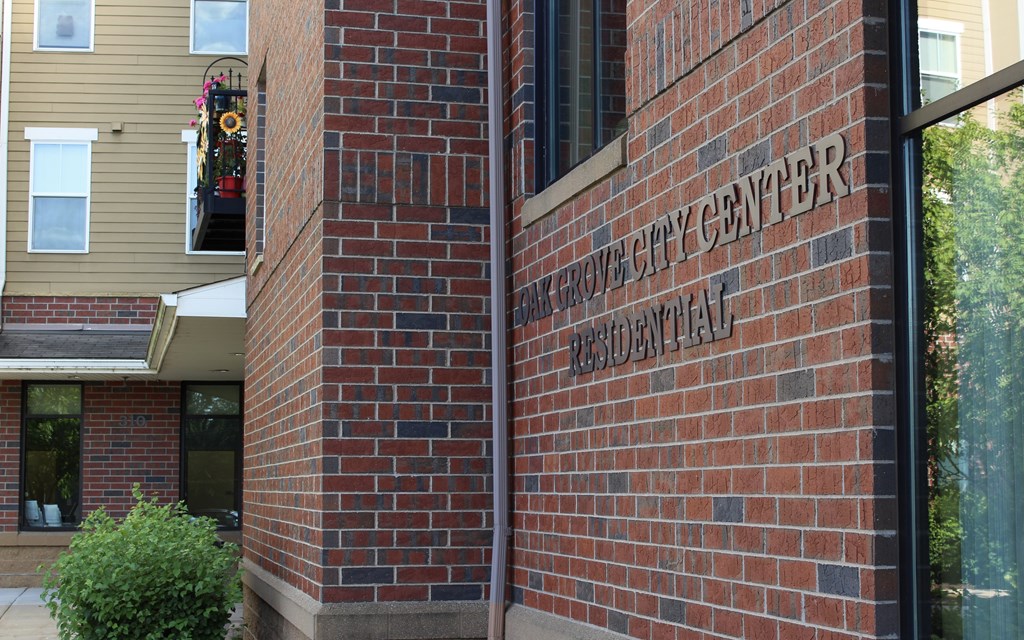 A brick building with a sign that says "Resident Life Center".