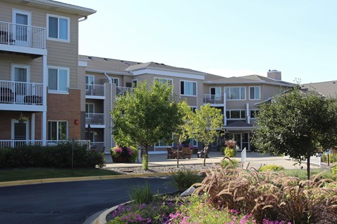 Apartment complex with a road in front of it.