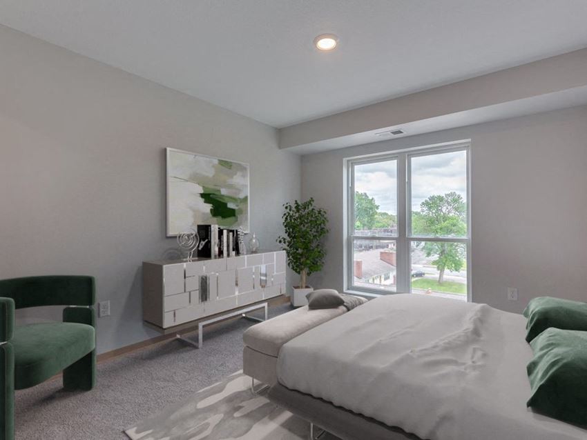 a bedroom with gray walls and a large window