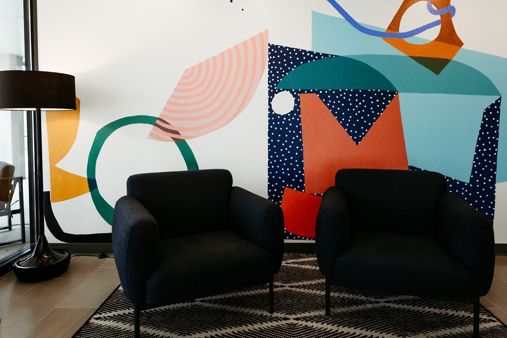 Two Lounge Chairs and Lamp in common area