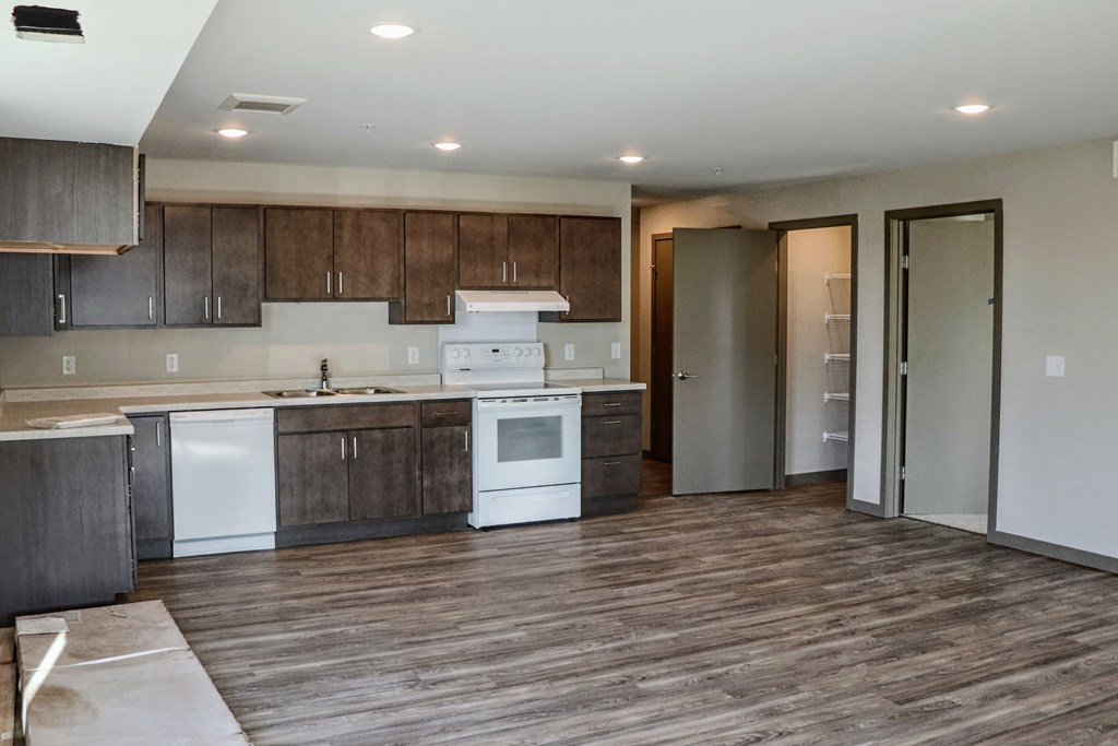 a kitchen and living room in a 555 waverly unit