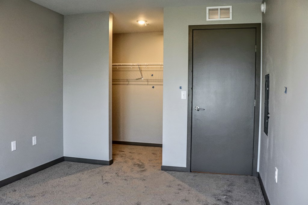 a walk in closet in a 555 waverly unit