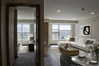 a view of the living room and bedroom from the dining room