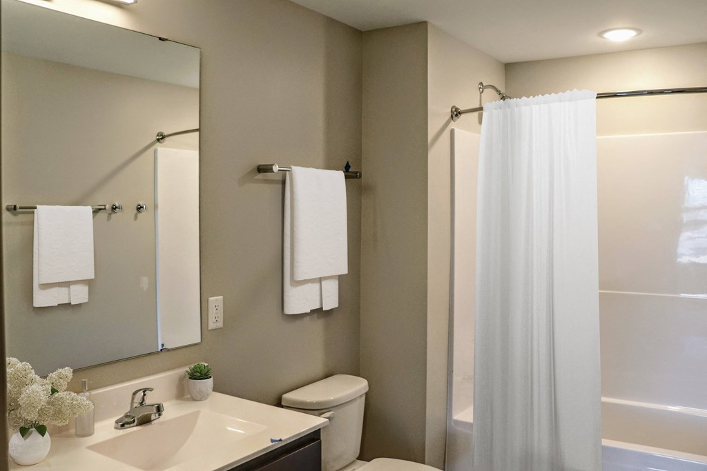a bathroom with a toilet sink and bathtub