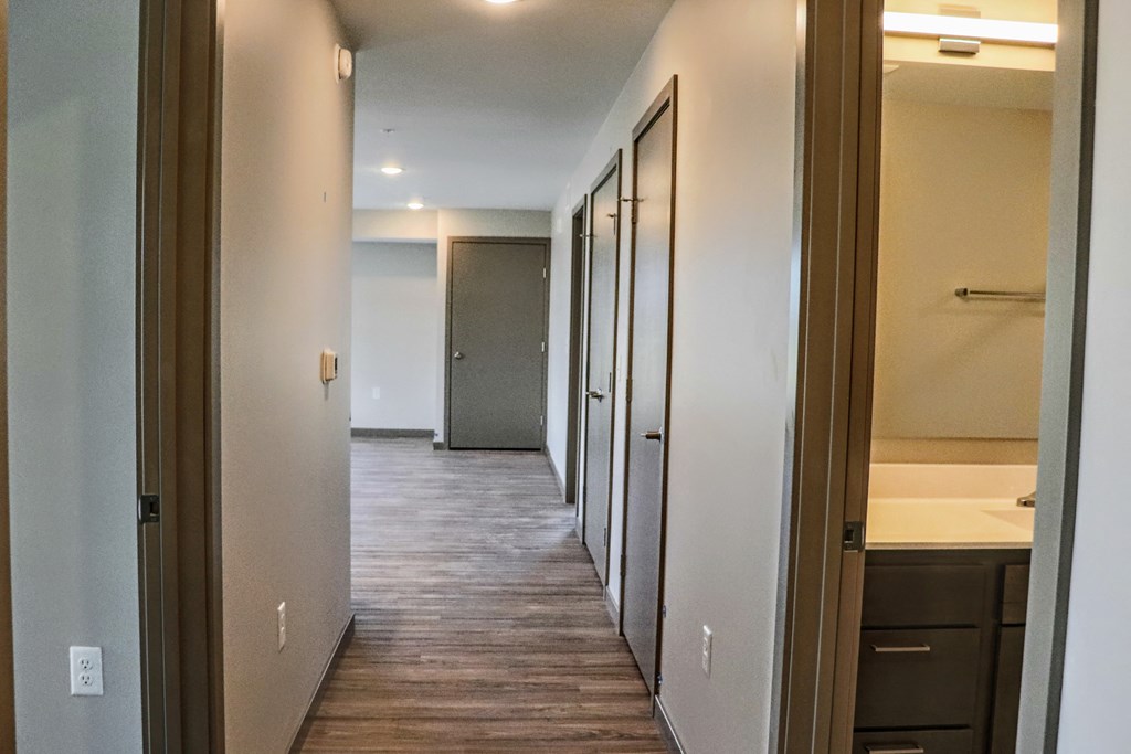 a look down the hallway of a 560 square foot, 1 bedroom apartment at the casey