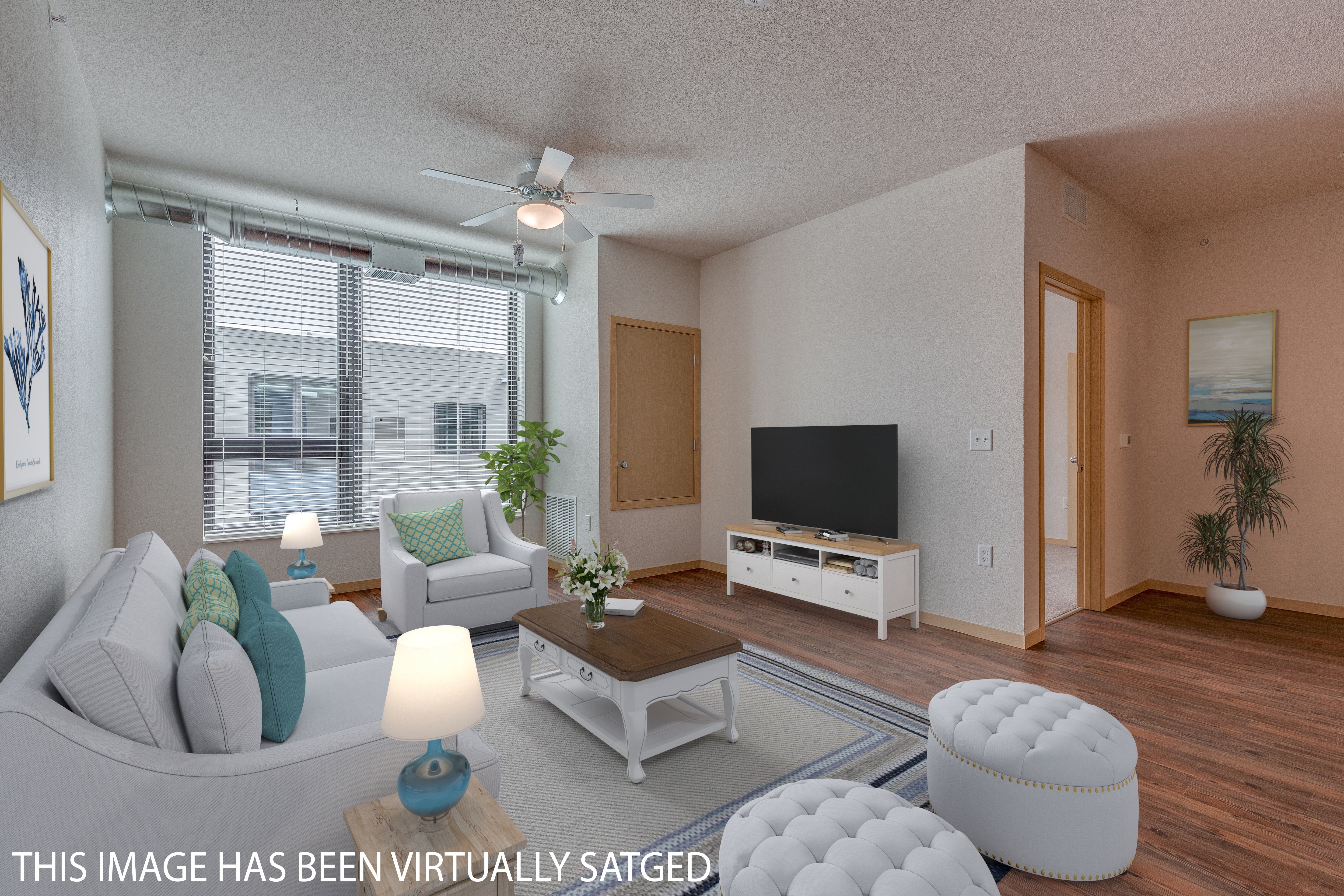 an image of a living room with furniture and a tv