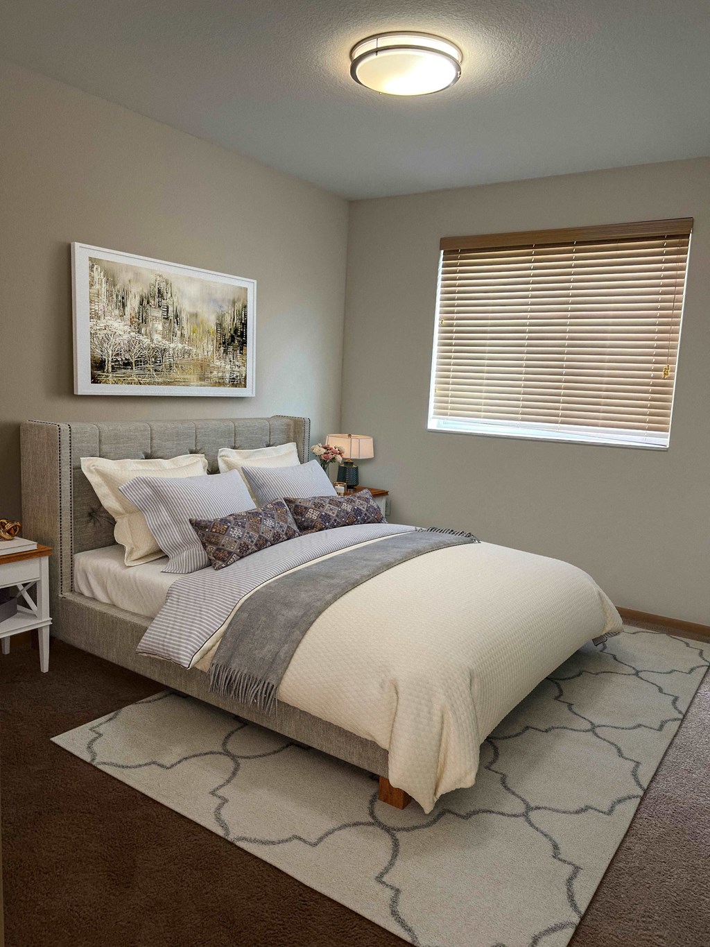 a bedroom with a bed and a window and a rug