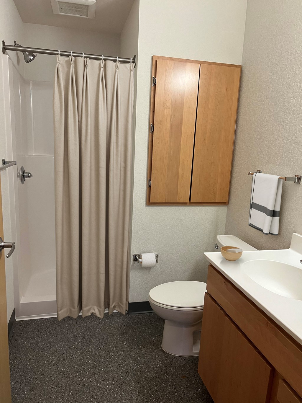 a bathroom with a shower toilet and sink