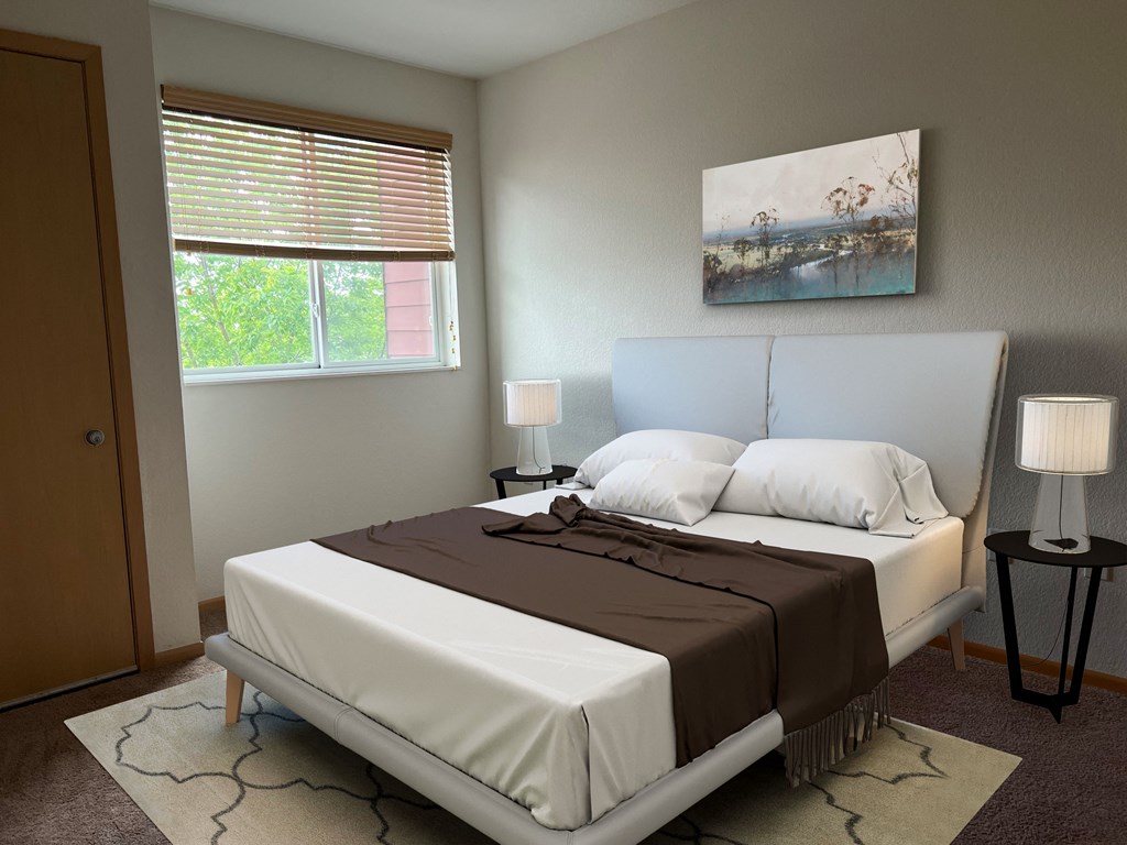 a bedroom with a bed and a painting on the wall