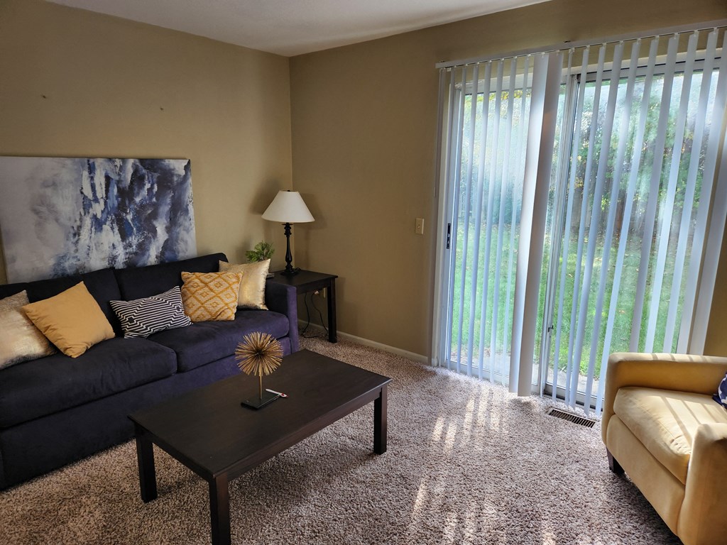a living room with a couch and a table
