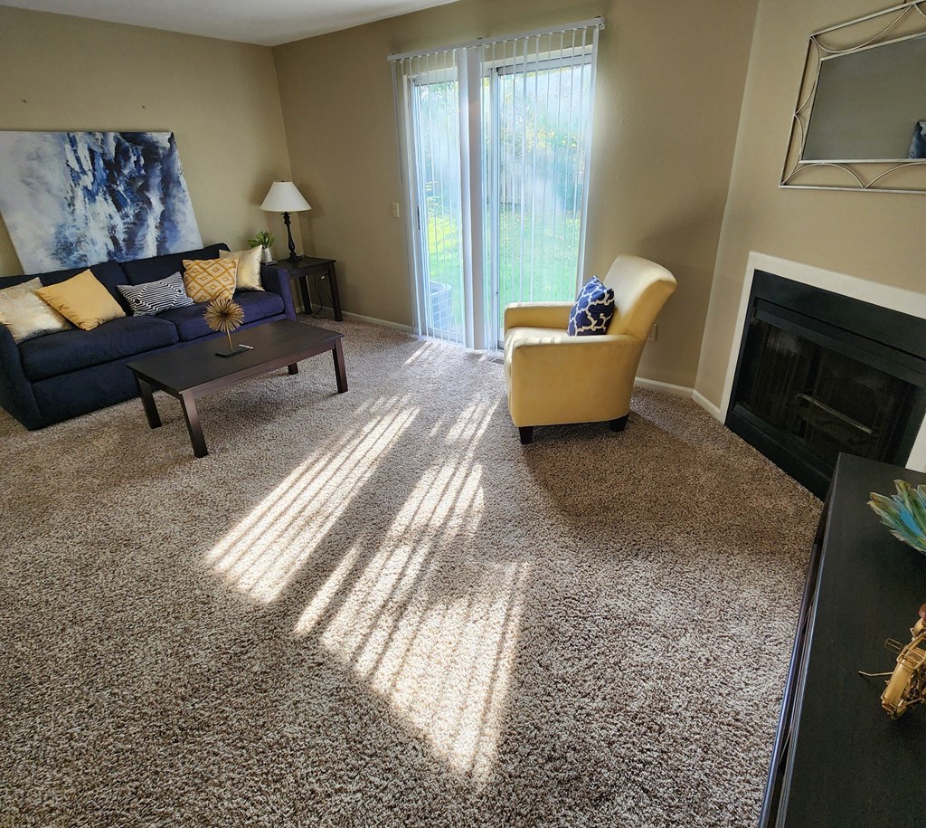 a living room with a couch and a fireplace