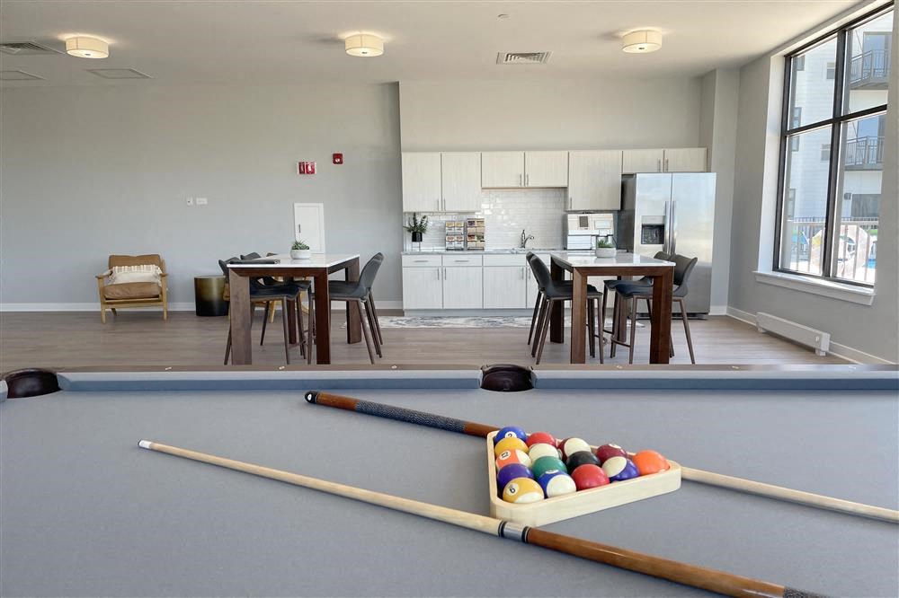 a living room with a pool table and