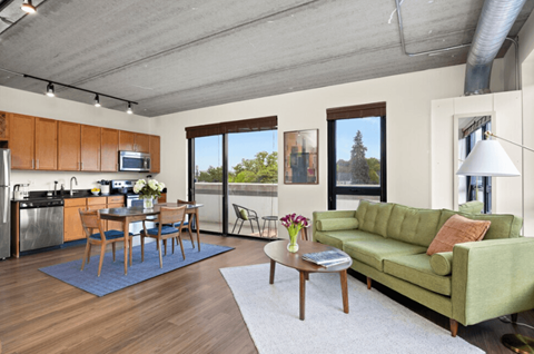 A modern kitchen with a dining table and chairs.