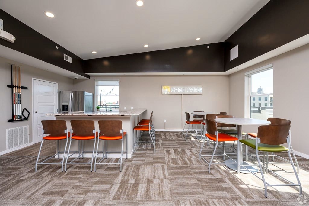 A conference room with a long table and chairs.