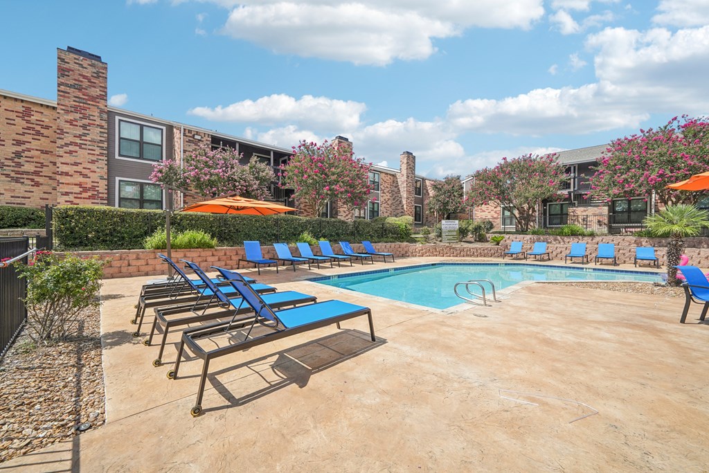 our apartments have a resort style pool and lounge chairs