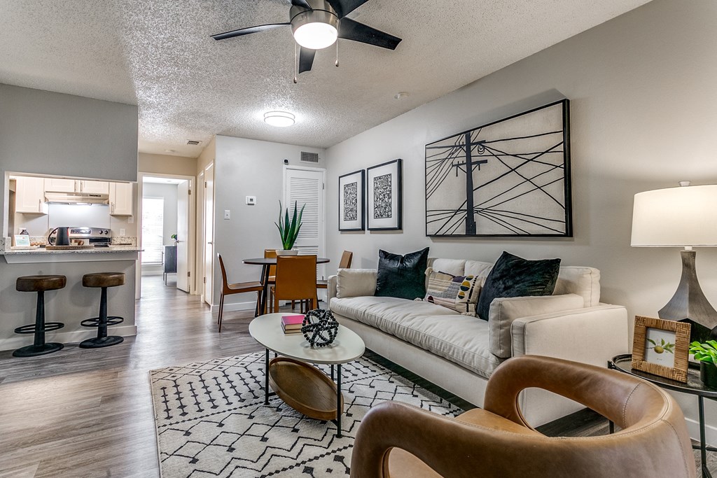 an open living room and kitchen with a couch and a table