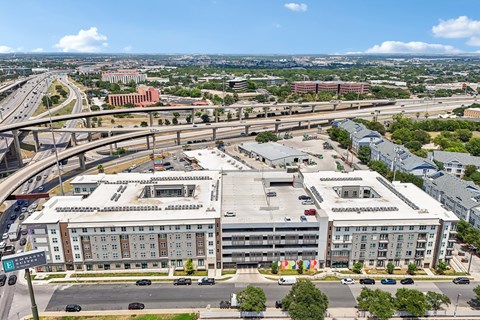 A large building with a parking lot in front of it.