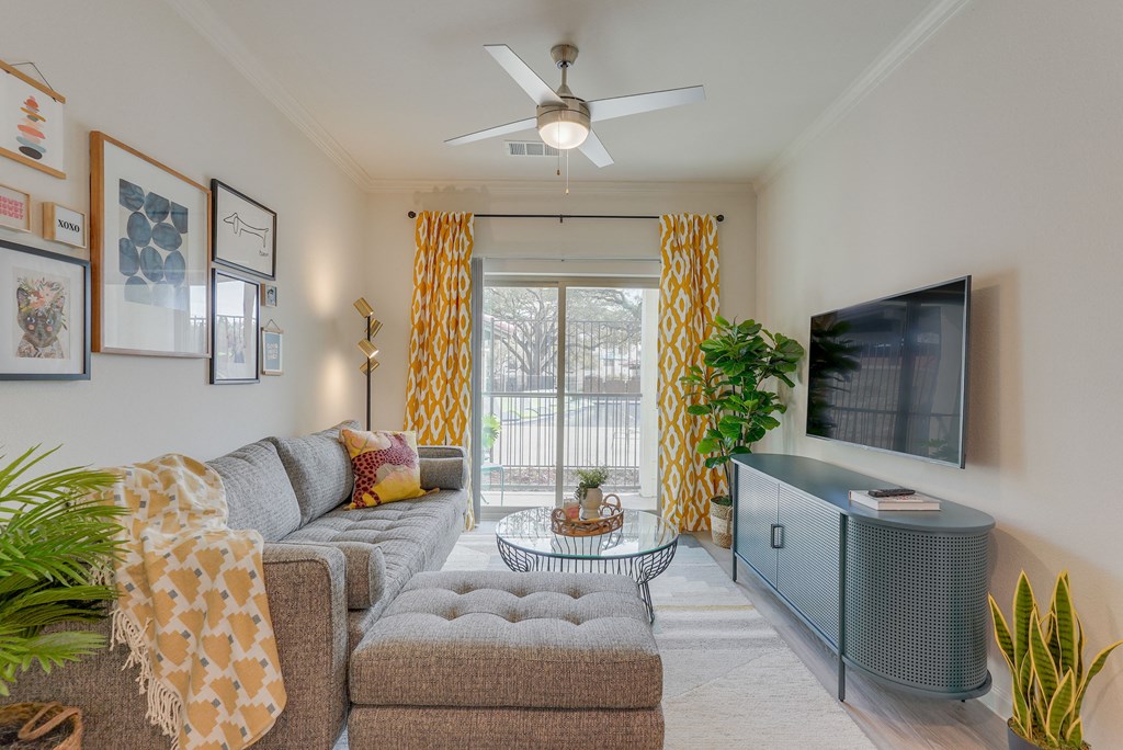 a living room with a couch and a tv