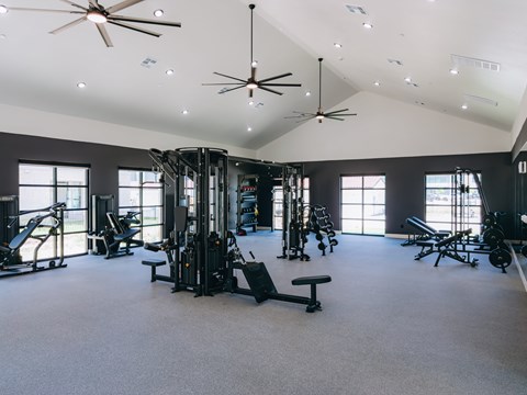 Fitness center with professional gym equipment at Northwoods Apartments, Spring