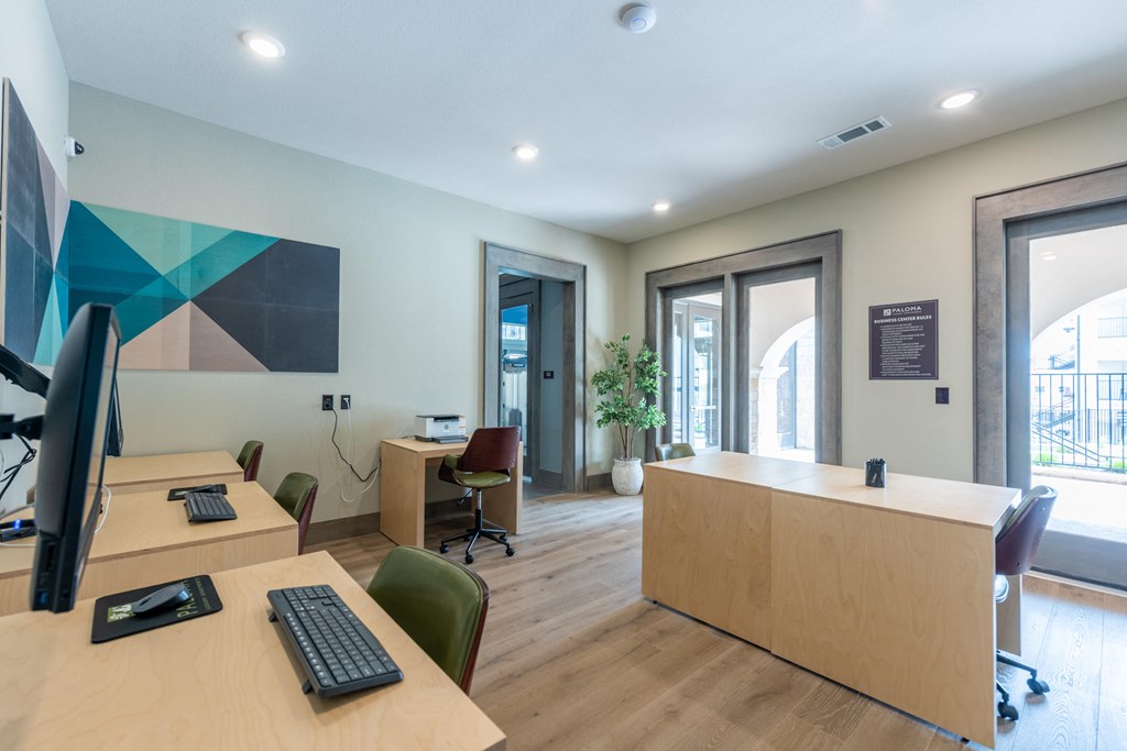 Business center with computers and printer at Bridge at Paloma Affordable Apartments 78754 Northeast Austin