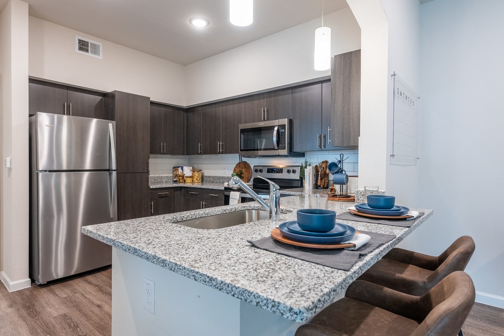 Granite Counters and Stainless Steel Appliances in 78754 at Bridge at Paloma