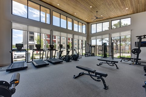 Fitness center with cardio and weight equipment at Bridge at Saffron Apartments, Austin, 78717