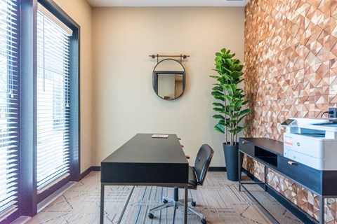 a desk with a printer and a mirror on the wall at Avery Ranch, Texas, 78717