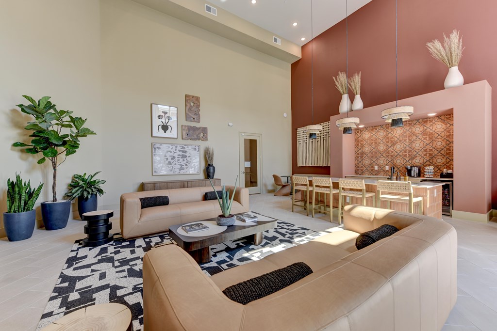 A living room with a brown sofa and a coffee table.