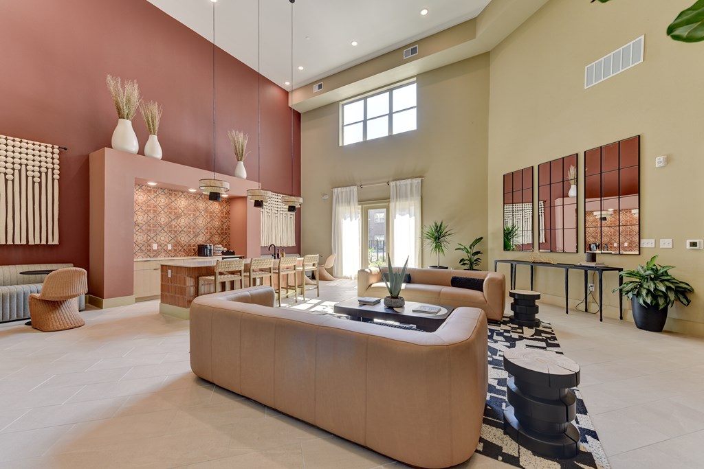 A modern living room with a large sofa and a coffee table.
