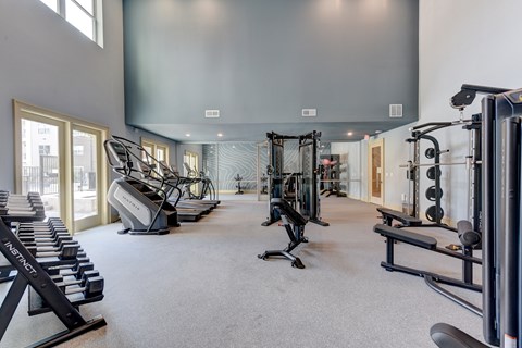 Fitness center with cardio and strength equipment at Cantarra Apartments, Manor, TX 78653