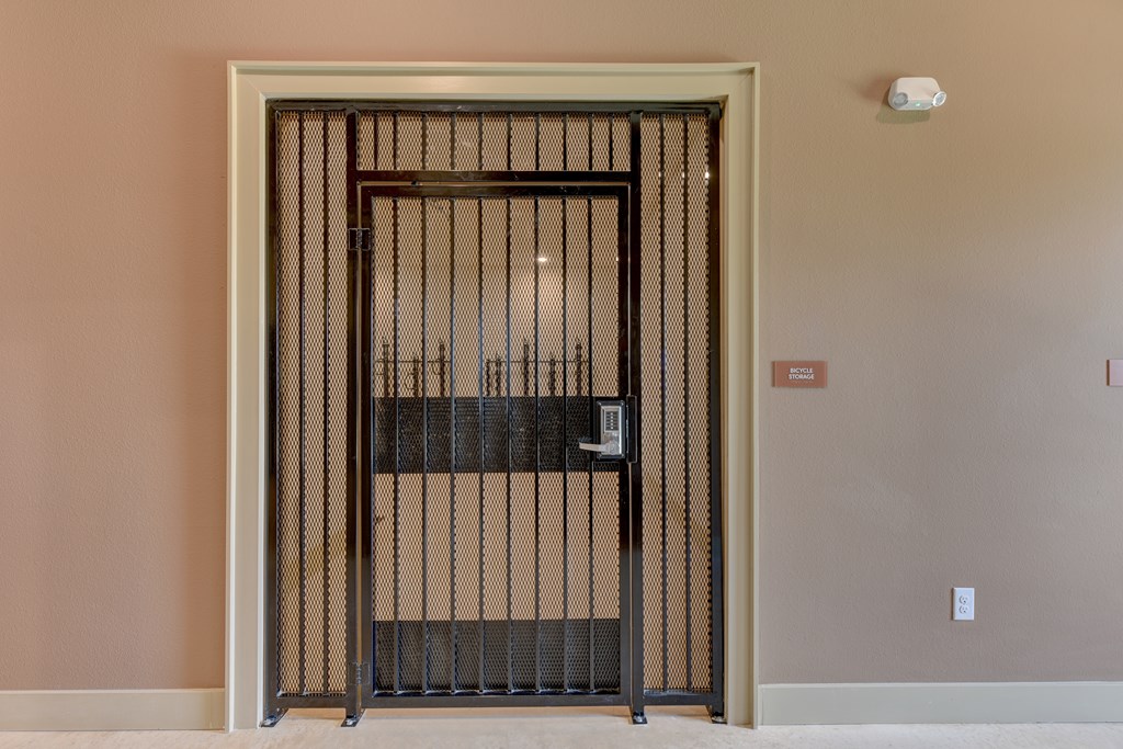 A metal gate with bars is closed.