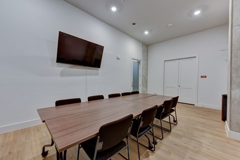 Conference room with wall mounted tv at Matador Apartments, Austin, TX 78745