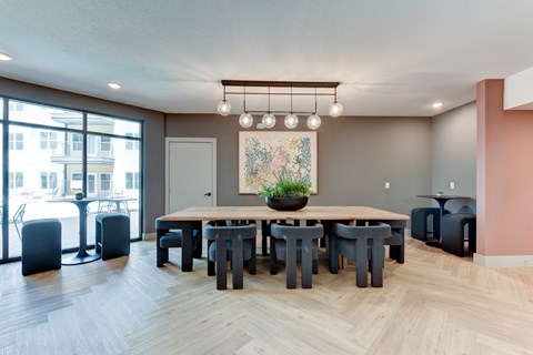 A dining room with a large table and chairs. at Park South Apartments, Austin, TX
