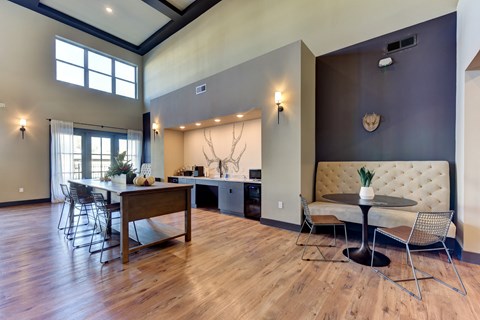 A dining room with a wooden table and chairs at Bridge at Speyside Apartments, Austin, Texas