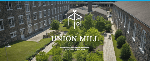 A view of a courtyard surrounded by buildings at Union Mill.