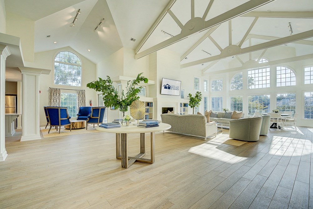 a large living room with white walls and ceiling and hardwood flooring  at The Vinings Apartments, Richmond