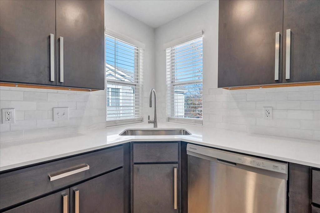 a kitchen with a sink and a window at The Vinings Apartments, Richmond, 23234