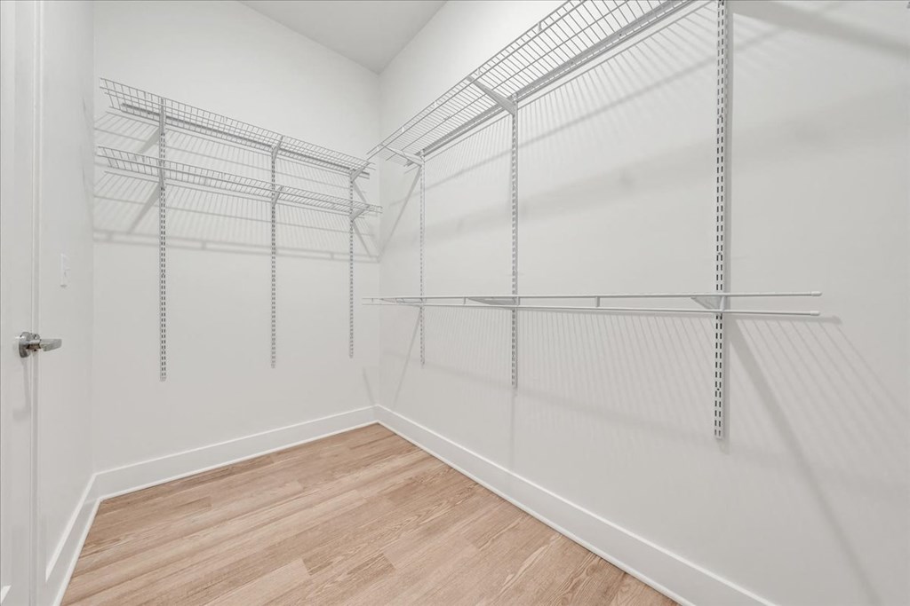 a room with white walls and wood floors at Luxe 360 in Midlothian, Midlothian, 23114