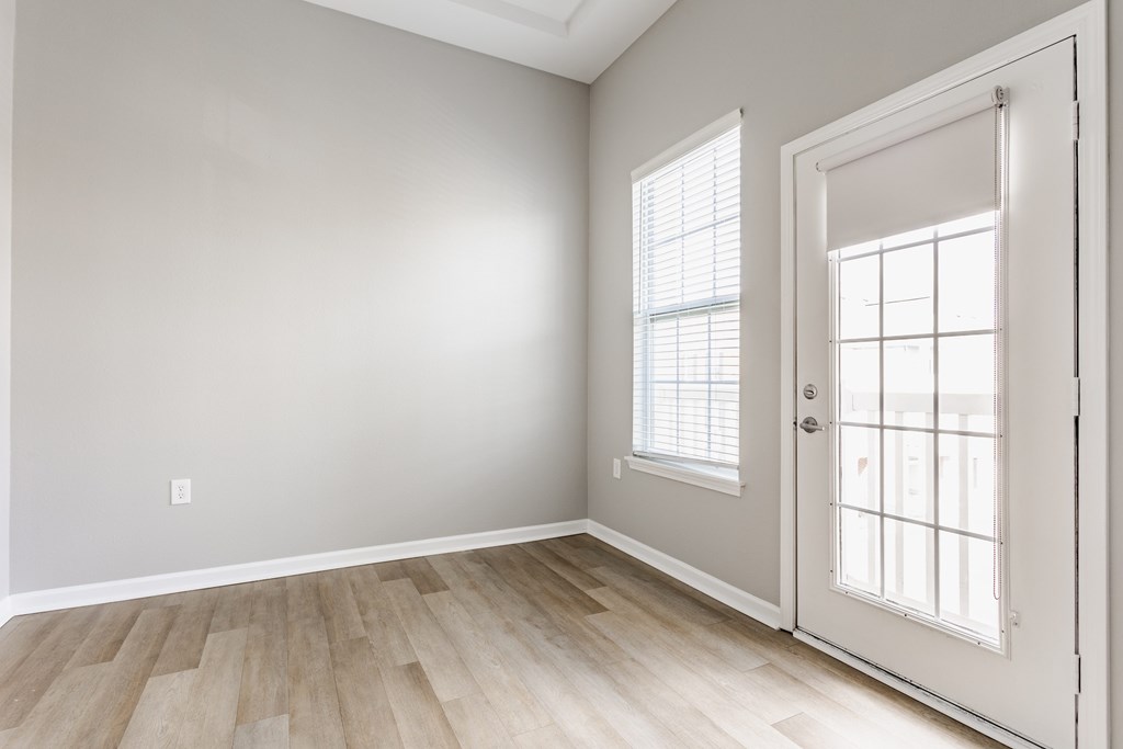 A room with a door and a window.