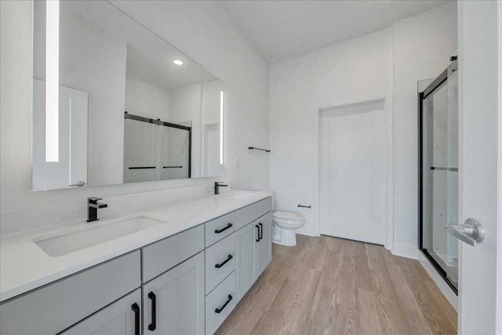 a bathroom with a sink and a toilet at Luxe 360 on Centerpointe Apartments, Midlothian, Virginia