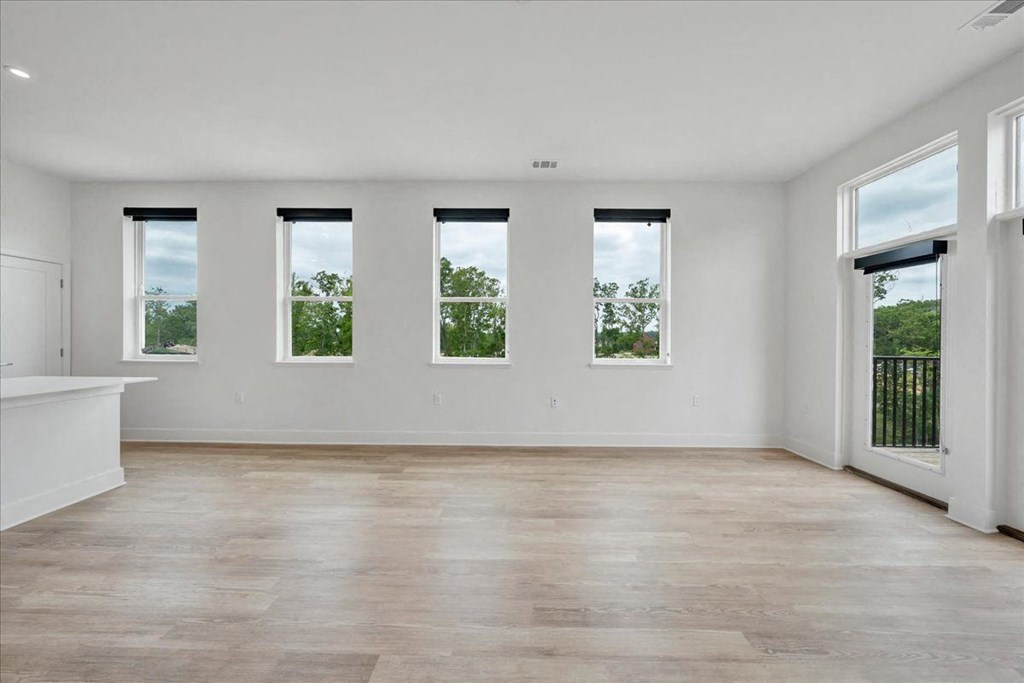 an empty living room at Luxe 360 on Centerpointe Apartments, Midlothian, VA